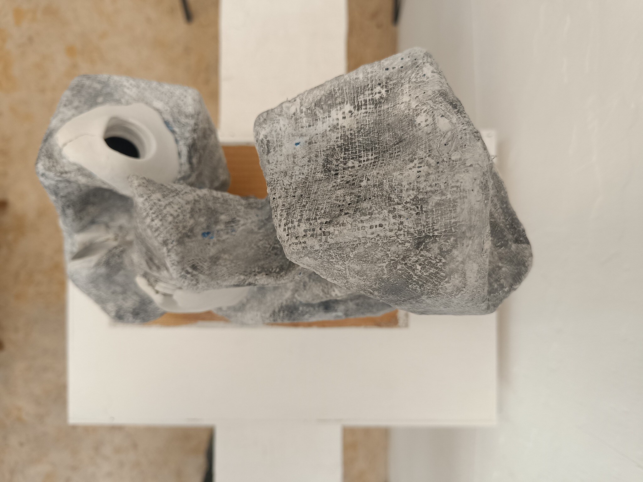 Close view of a Hole Object showing a white opening and textured grey surface